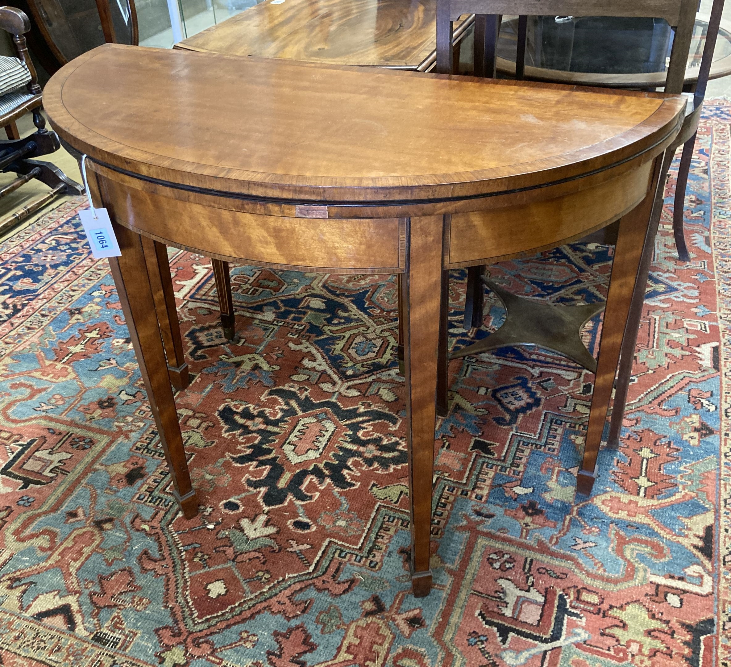 A George III satinwood demi lune folding card table, width 91cm, depth 42cm, height 71cm